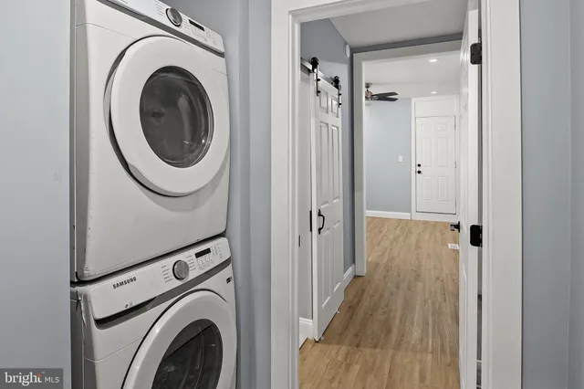 a view of a hallway with washer and dryer