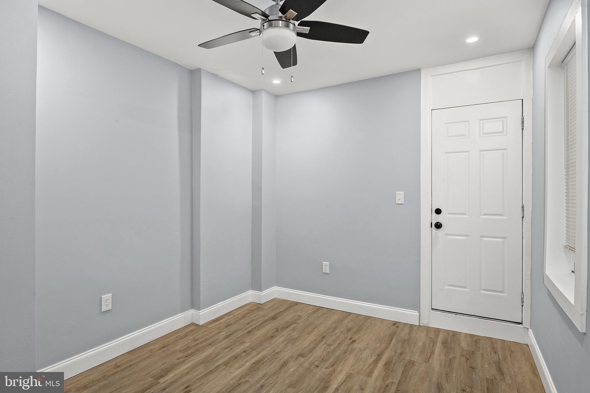 2112 Eastern Avenue Baltimore, MD 21231 - Photo 13 of 43 wooden floor in an empty room with a window