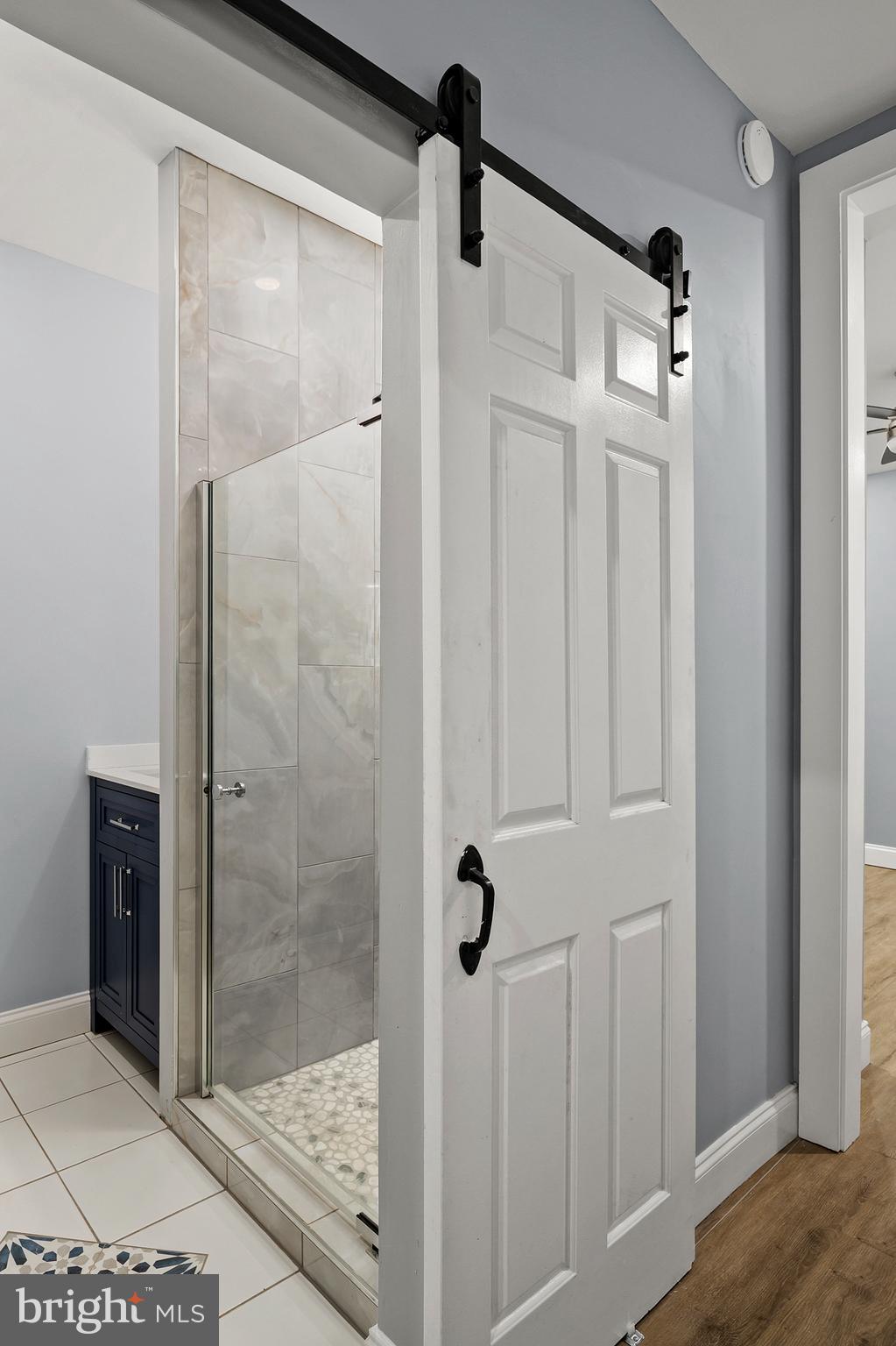 2112 Eastern Avenue Baltimore, MD 21231 - Photo 17 of 43 a bathroom with a shower and mirror