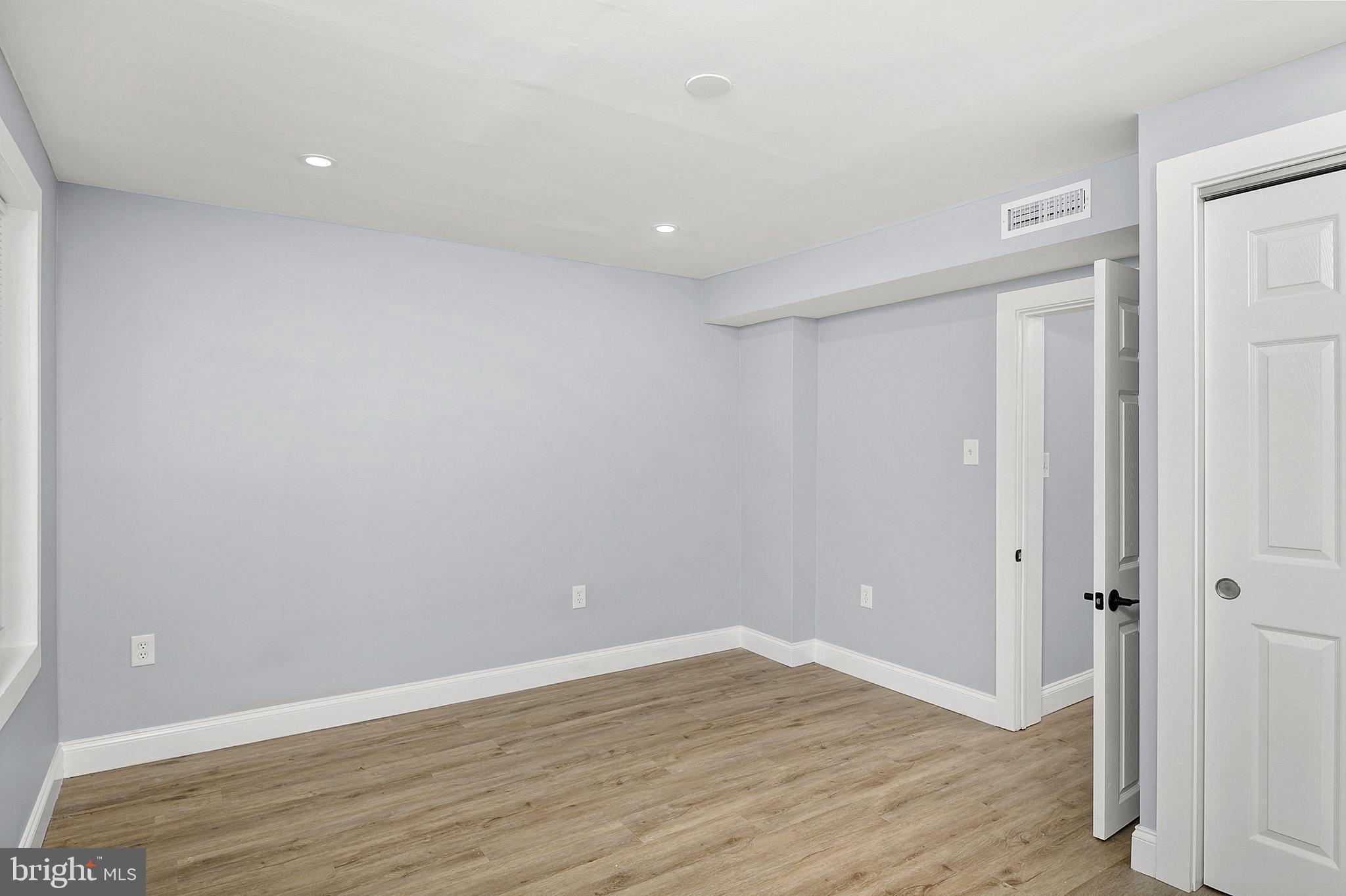 2112 Eastern Avenue Baltimore, MD 21231 - Photo 21 of 43 a view of an empty room with wooden floor