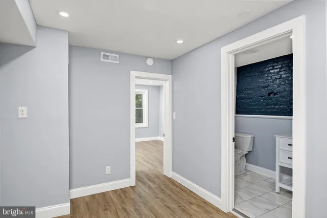 a view of a bathroom from a hallway