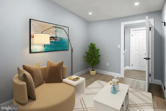 a living room with furniture and flowers