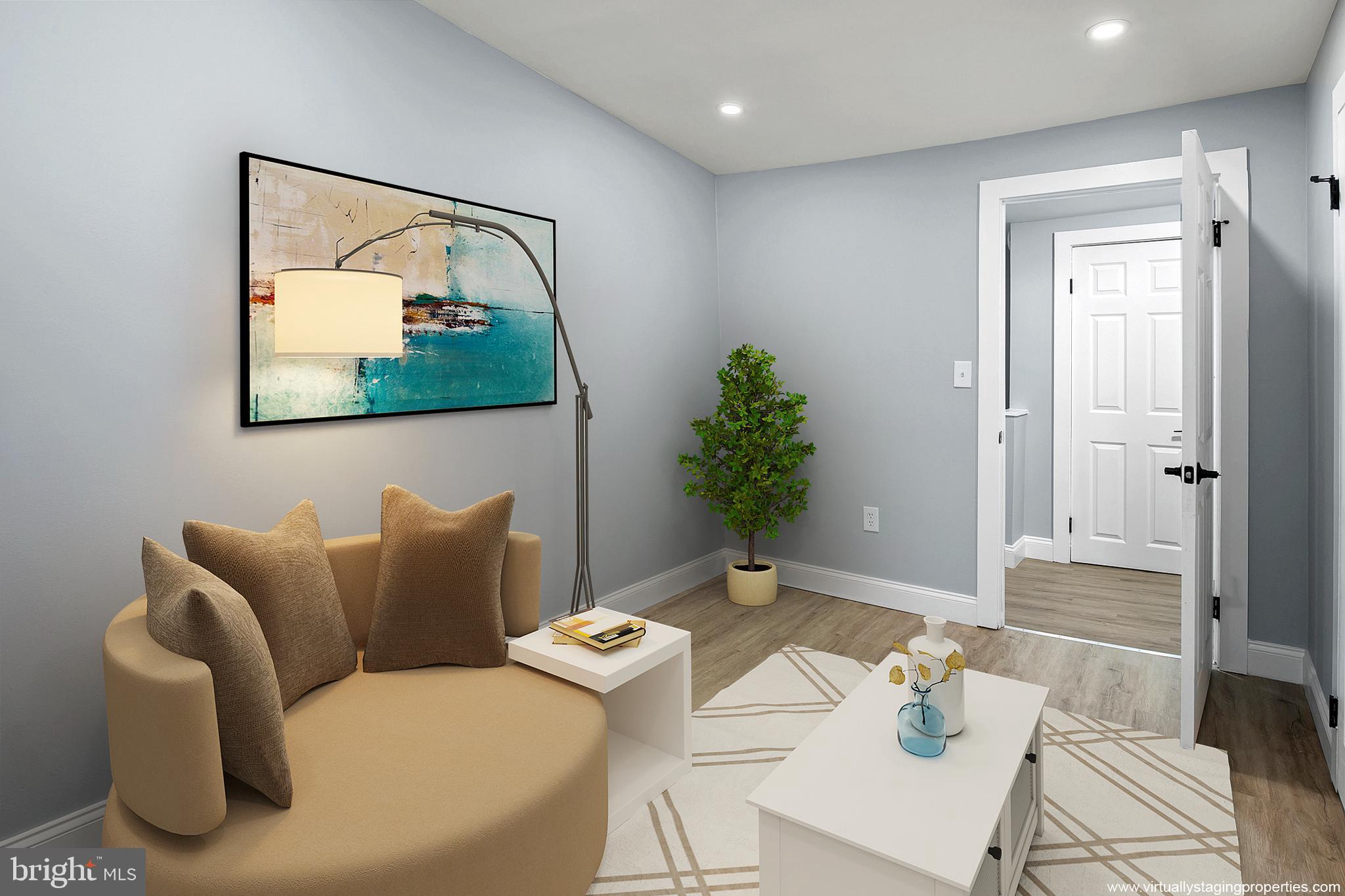 2112 Eastern Avenue Baltimore, MD 21231 - Photo 32 of 43 a living room with furniture and flowers