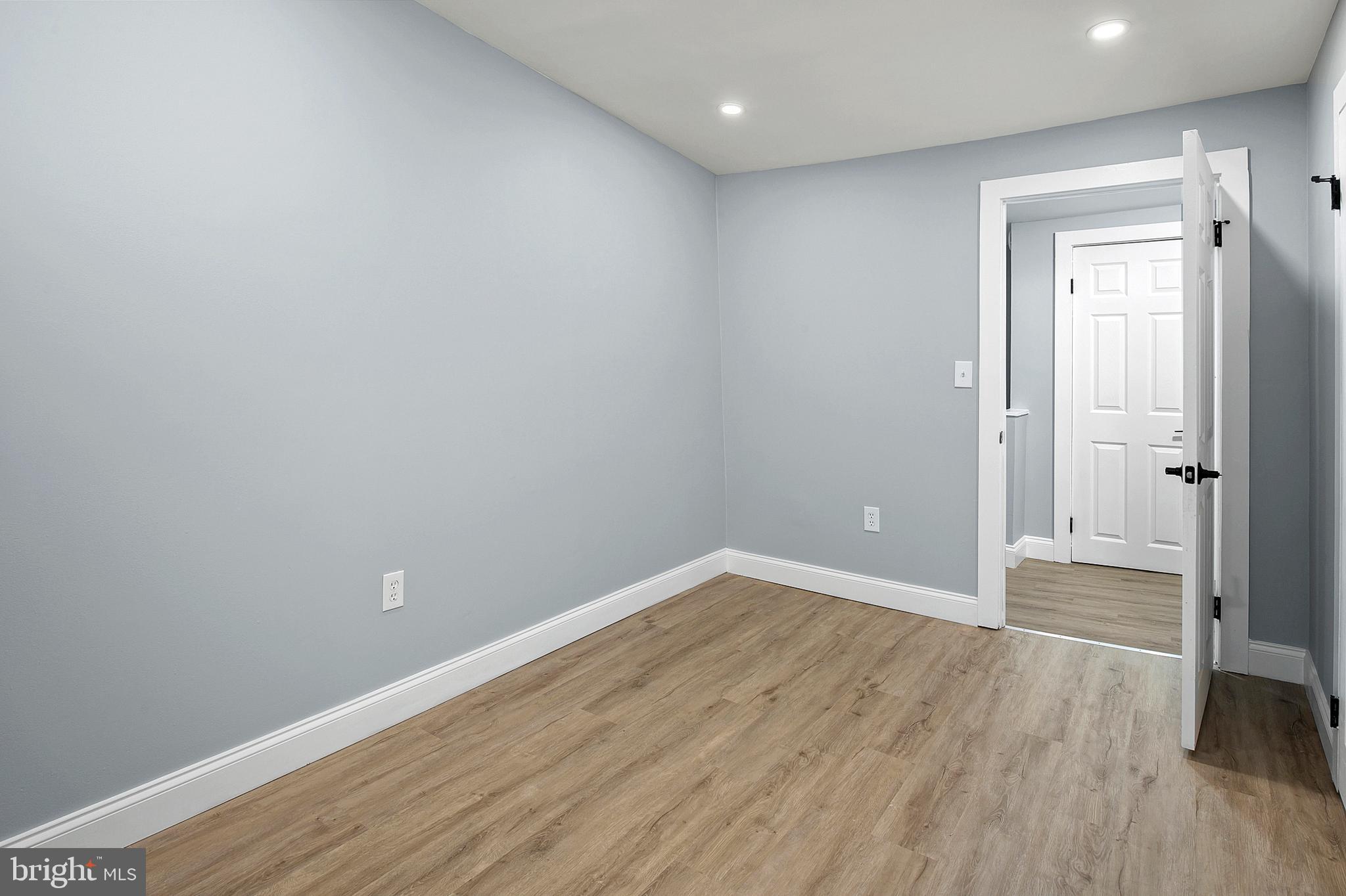 2112 Eastern Avenue Baltimore, MD 21231 - Photo 33 of 43 wooden floor in an empty room