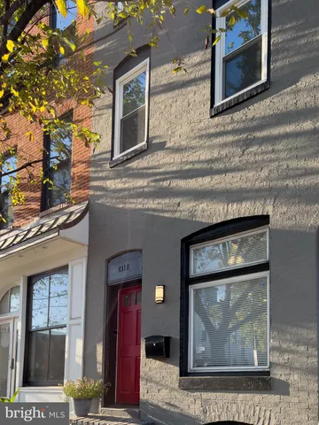 a picture of a bench in front of a door