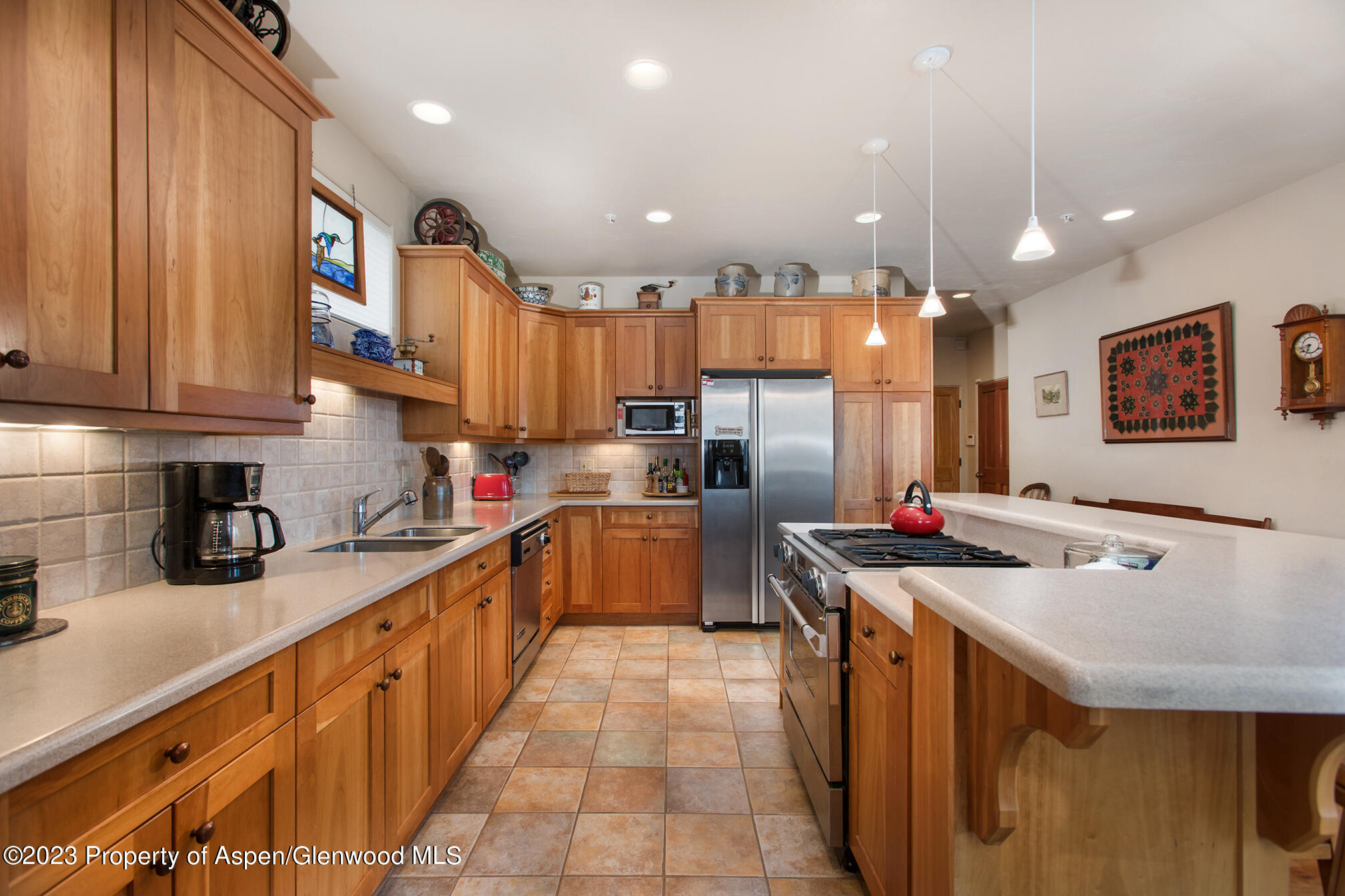 764 Promontory Lane Basalt, CO 81621 - Photo 15 of 43 a kitchen with stainless steel appliances granite countertop a sink a stove and a refrigerator