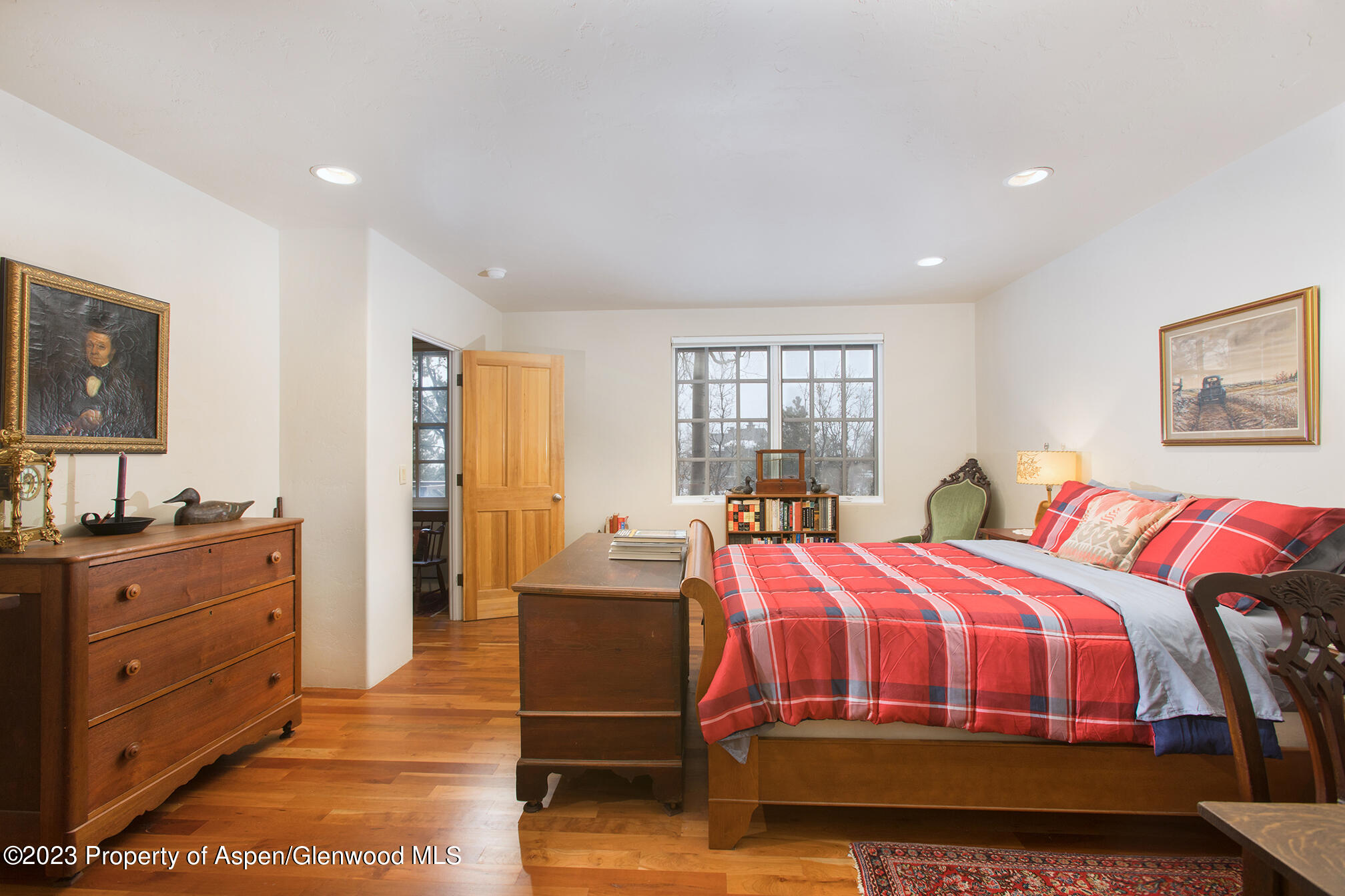 764 Promontory Lane Basalt, CO 81621 - Photo 30 of 43 a bedroom with a bed and wooden floor