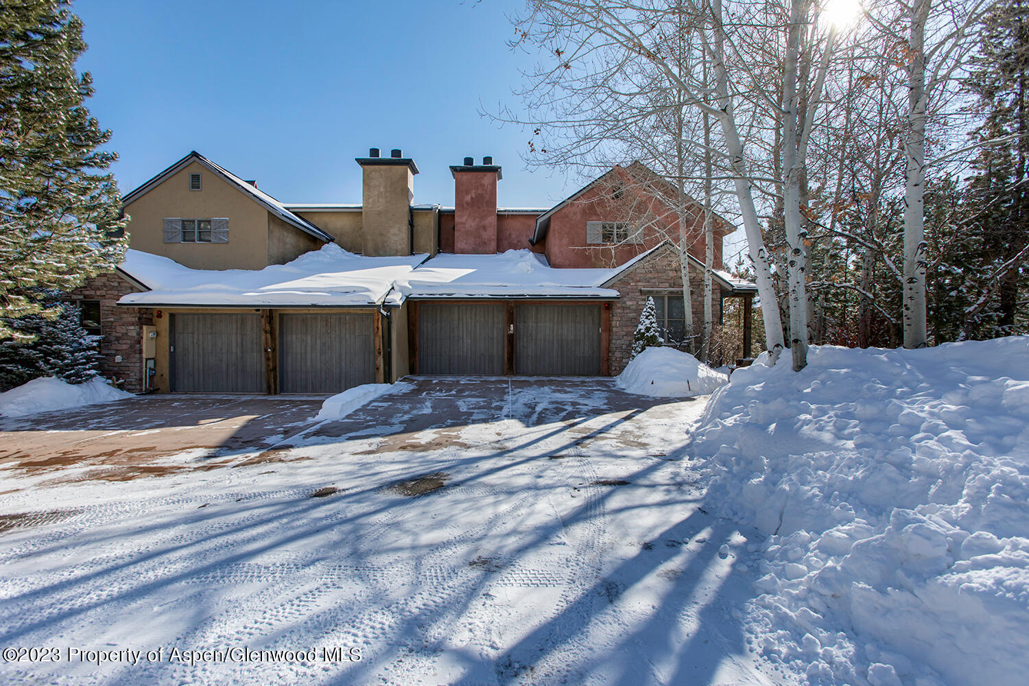 764 Promontory Lane Basalt, CO 81621 - Photo 4 of 43 a front view of a house with a yard and garage