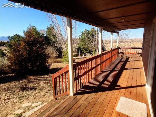 10380 Link Road Fountain, CO 80817 - Photo 27 of 35 Great views of the front range, Pikes Peak and Colorado sunsets from the large covered deck.