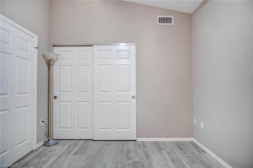 4450 Botanical Pl Circle, Unit 406 Naples, FL 34112 - Photo 13 of 16 a view of an empty room
