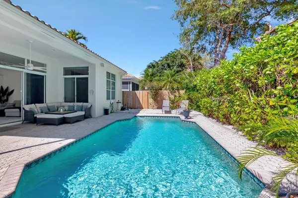 a view of a backyard with furniture