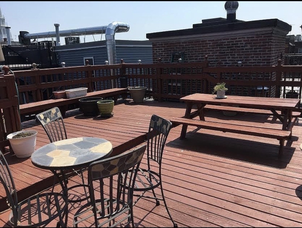69 North Margin Street, Unit B Boston, MA 02113 - Photo 13 of 13 a balcony with table and chairs