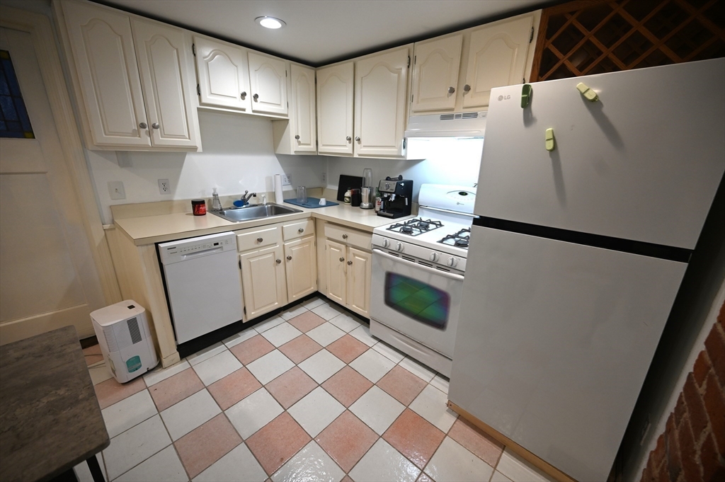 69 North Margin Street, Unit B Boston, MA 02113 - Photo 3 of 13 a kitchen with a cabinets and white appliances