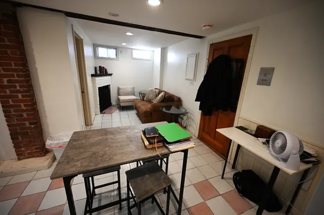 a workspace with furniture and mirror