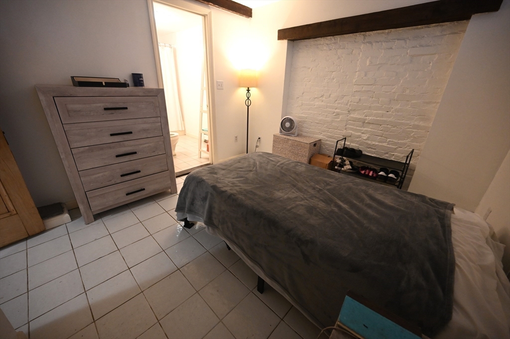 69 North Margin Street, Unit B Boston, MA 02113 - Photo 6 of 13 a bedroom with a bed and a cabinets