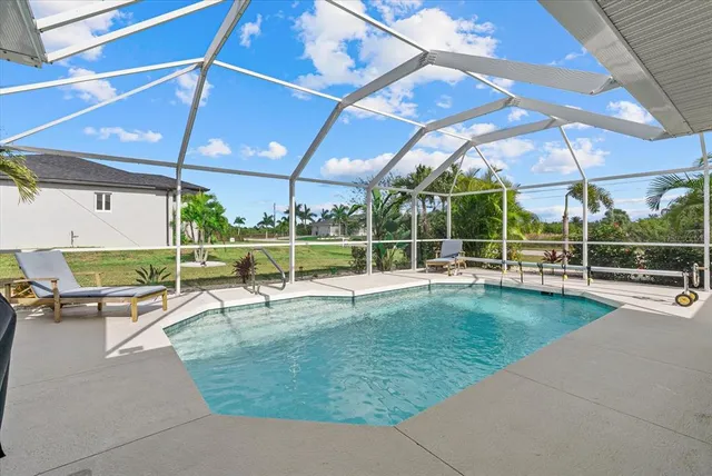 a view of a swimming pool with a patio