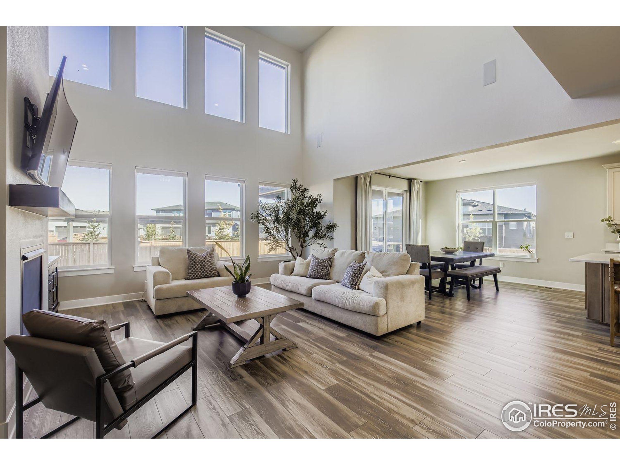 4359 Shivaree Street Timnath, CO 80547 - Photo 13 of 29 a living room with furniture and a wooden floor