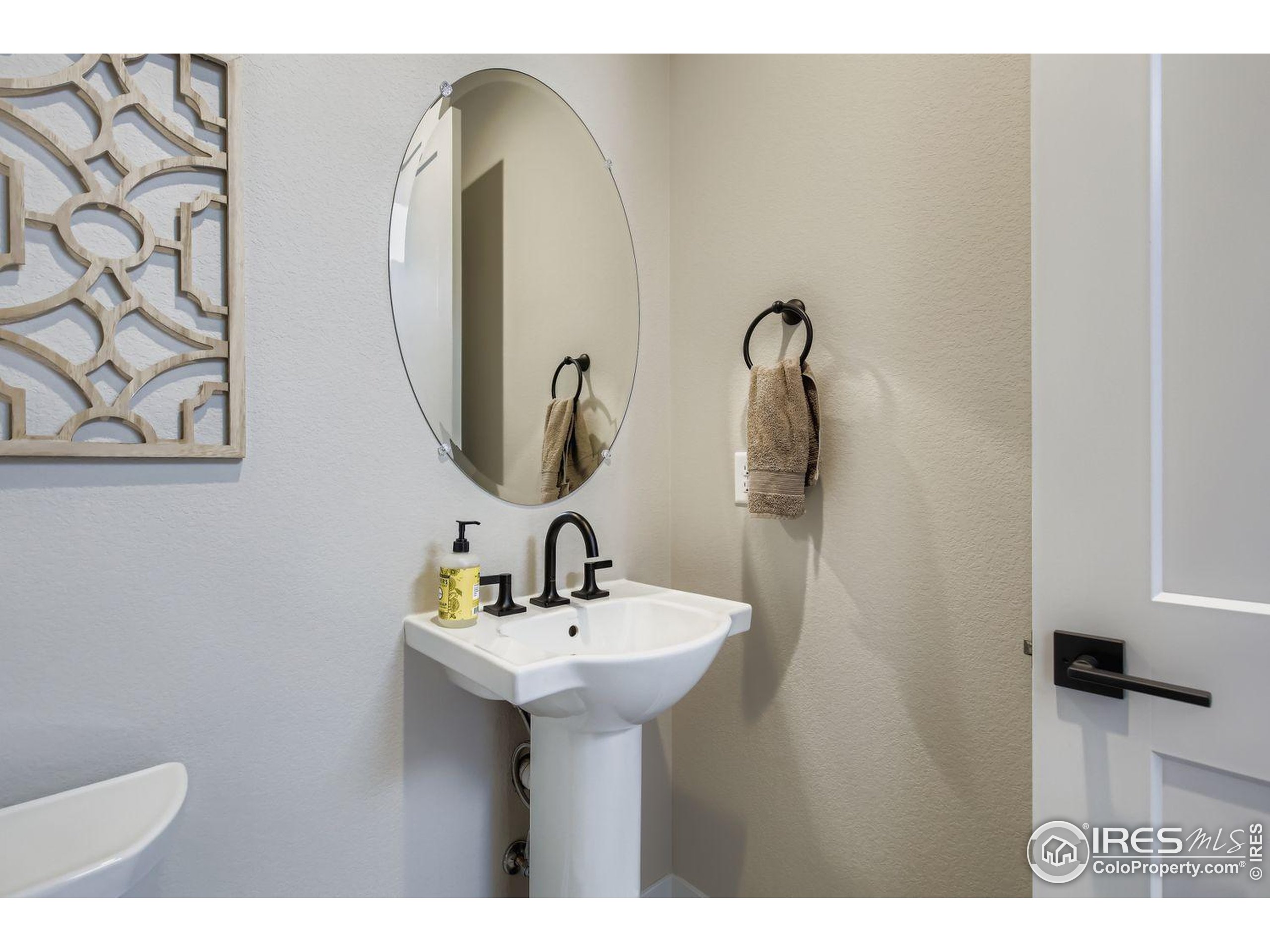 4359 Shivaree Street Timnath, CO 80547 - Photo 16 of 29 a bathroom with a sink and a mirror