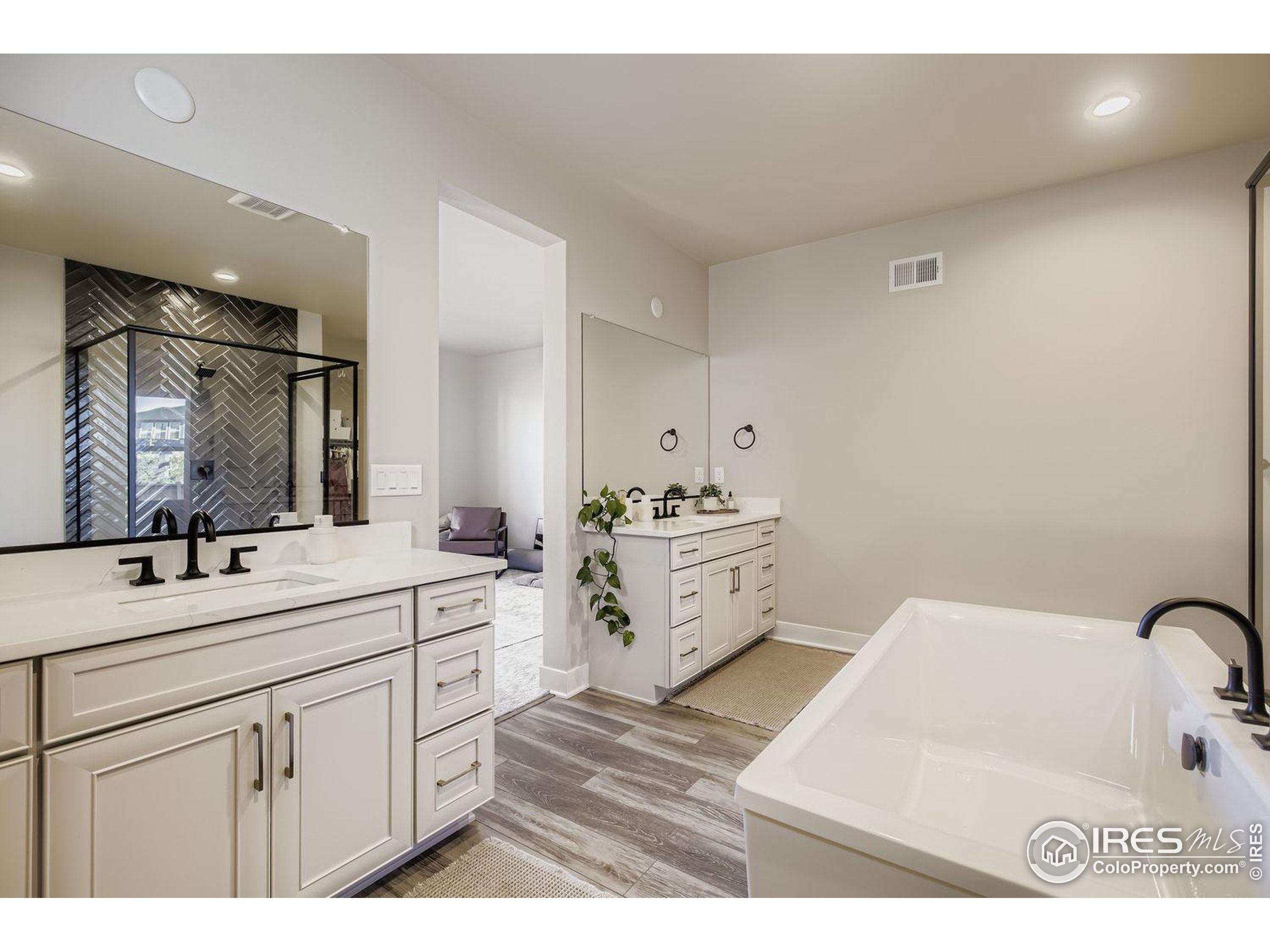 4359 Shivaree Street Timnath, CO 80547 - Photo 19 of 29 a bathroom with a sink and a mirror