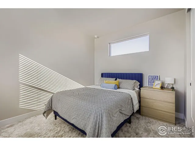 a bedroom with a bed and a cabinets