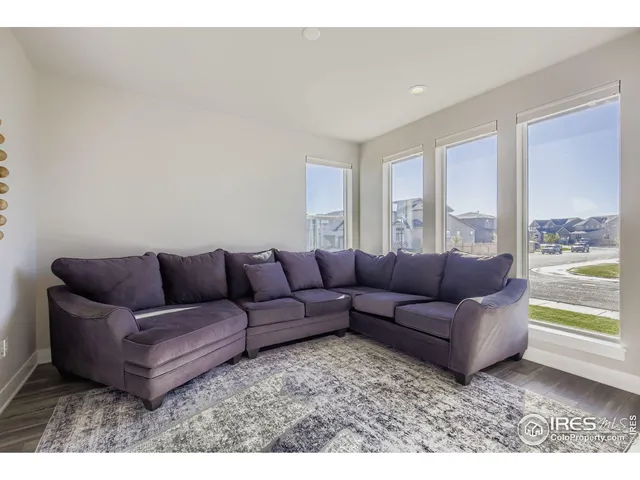 a living room with a couch and a large window
