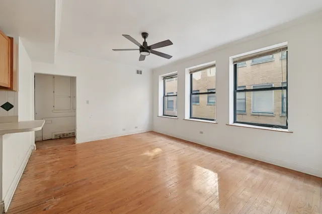 a view of an empty room with a window