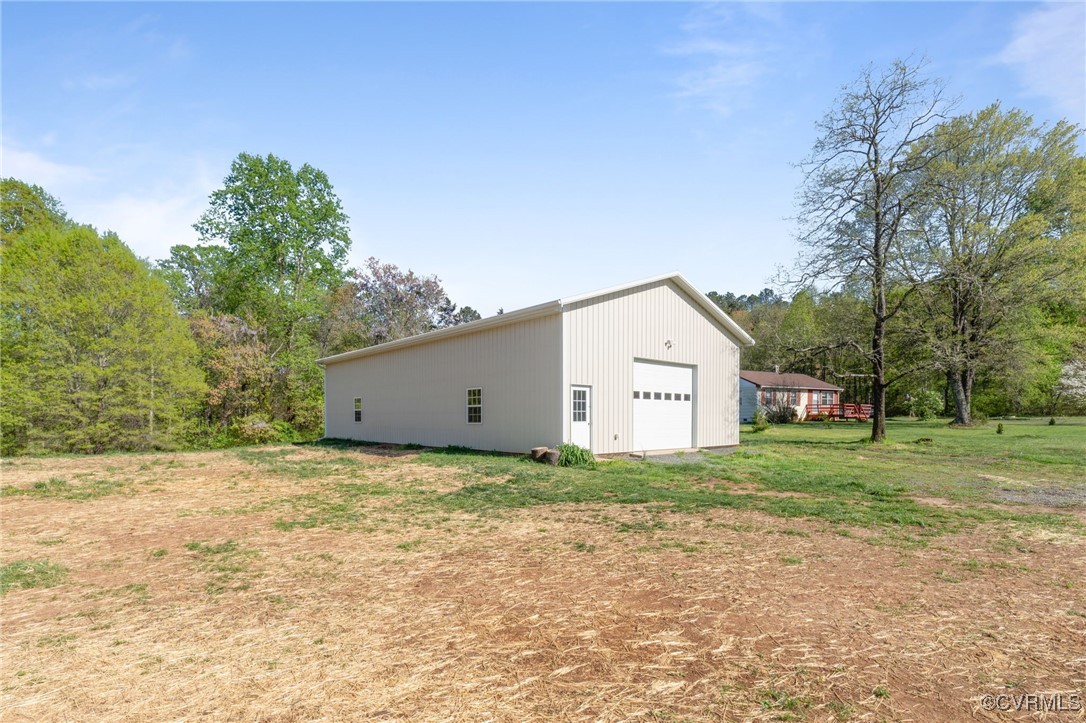 626 Haden Martin Road Palmyra, VA 22963 - Photo 42 of 44 View of home's exterior featuring a garage and an