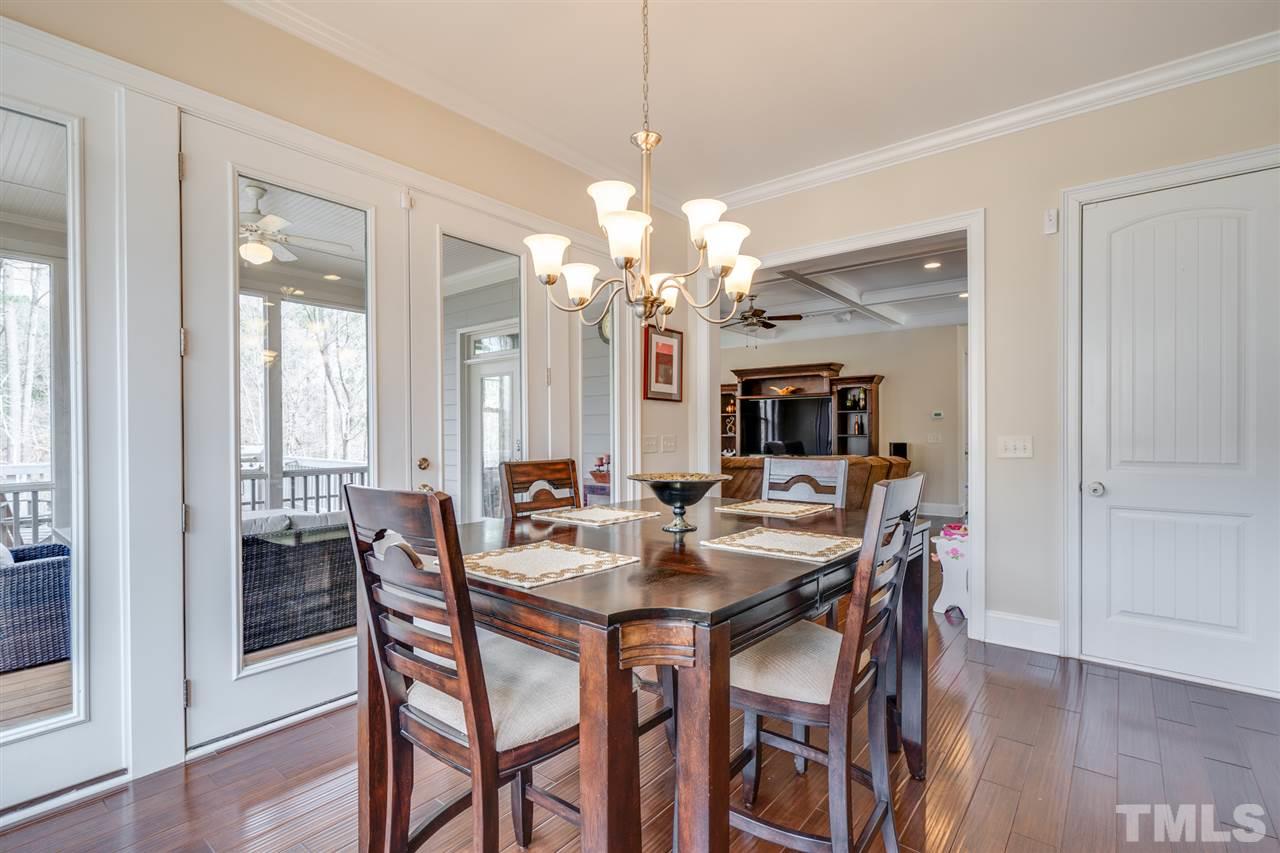 2212 Big Lake Court Raleigh, NC 27607 - Photo 12 of 30 Walk out to screened porch and view into the family room