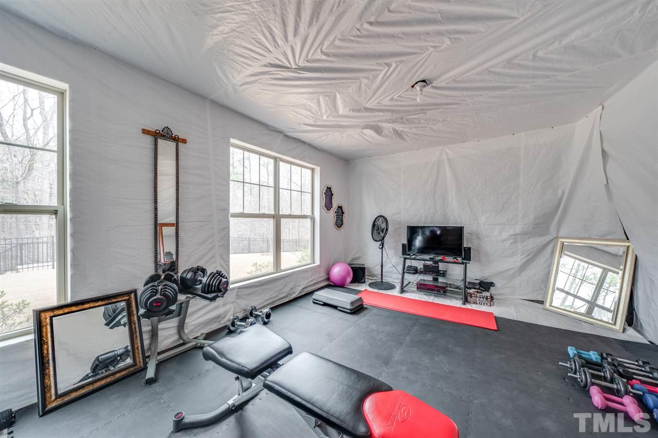 2212 Big Lake Court Raleigh, NC 27607 - Photo 26 of 30 Temporary workout room created in the unfinished basement.