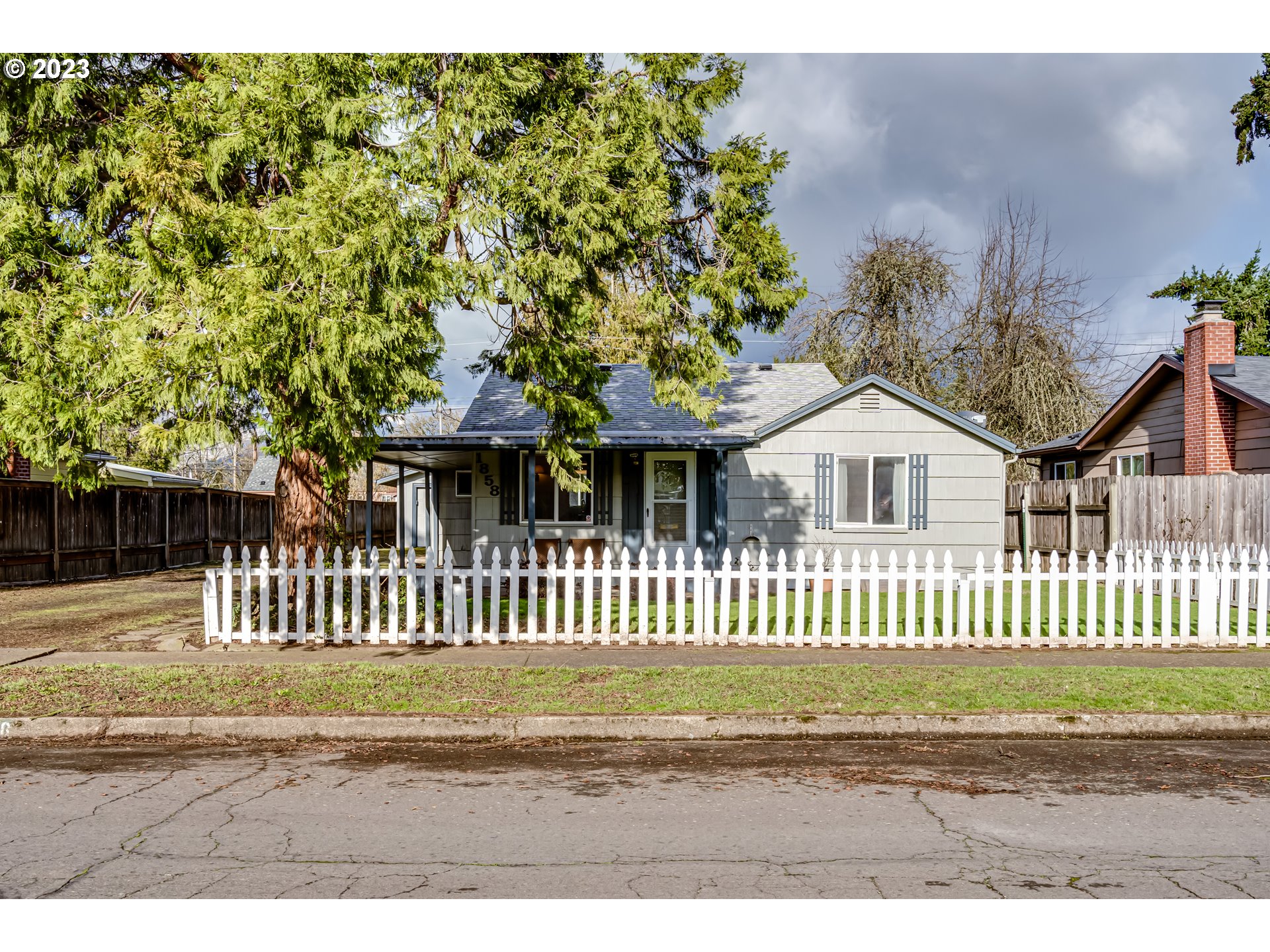 1858 I Street Springfield, OR 97477 - Photo 1 of 23 a view of a house with a wooden fence