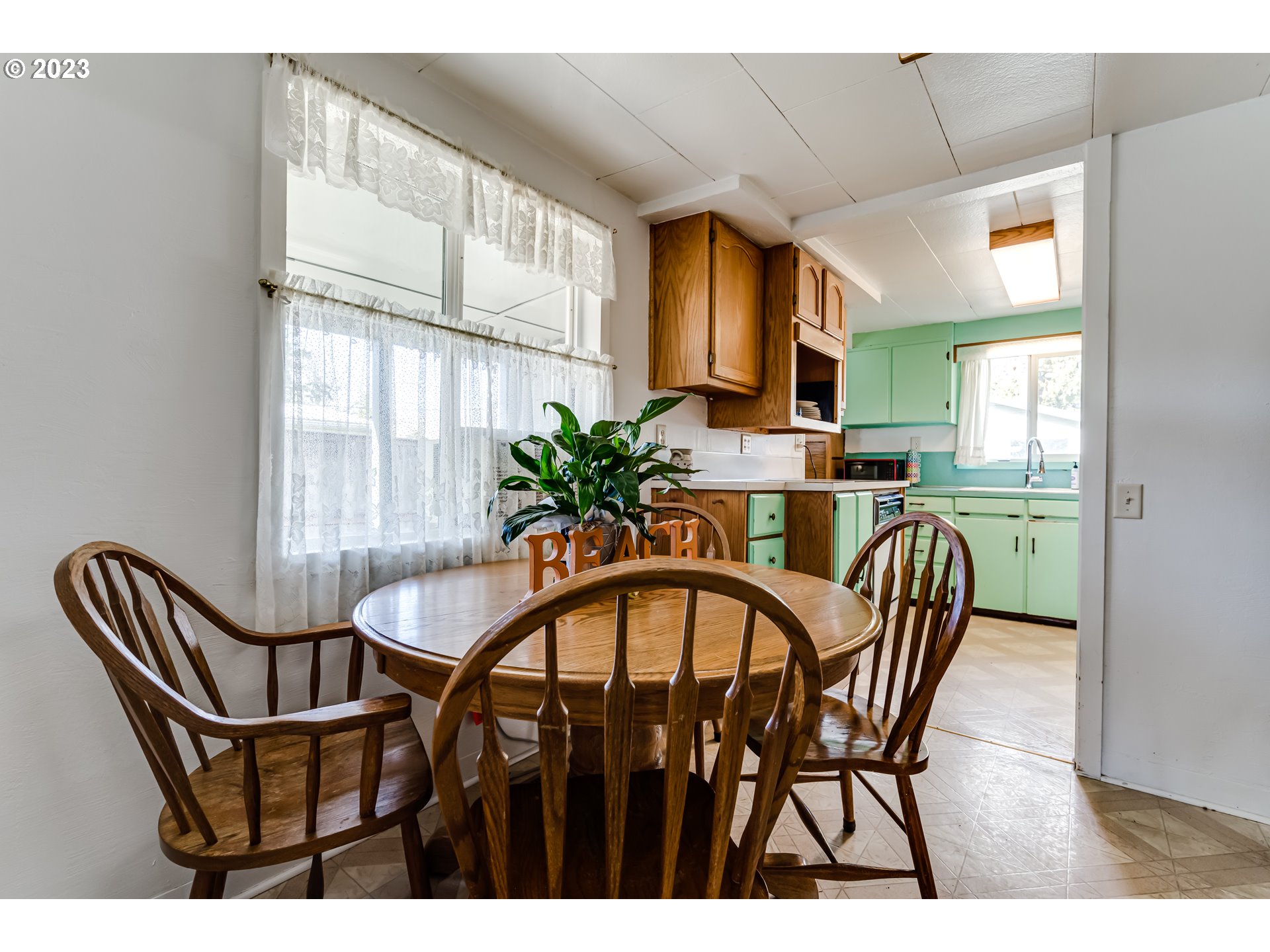 1858 I Street Springfield, OR 97477 - Photo 11 of 23 a view of a dining room with furniture and a window