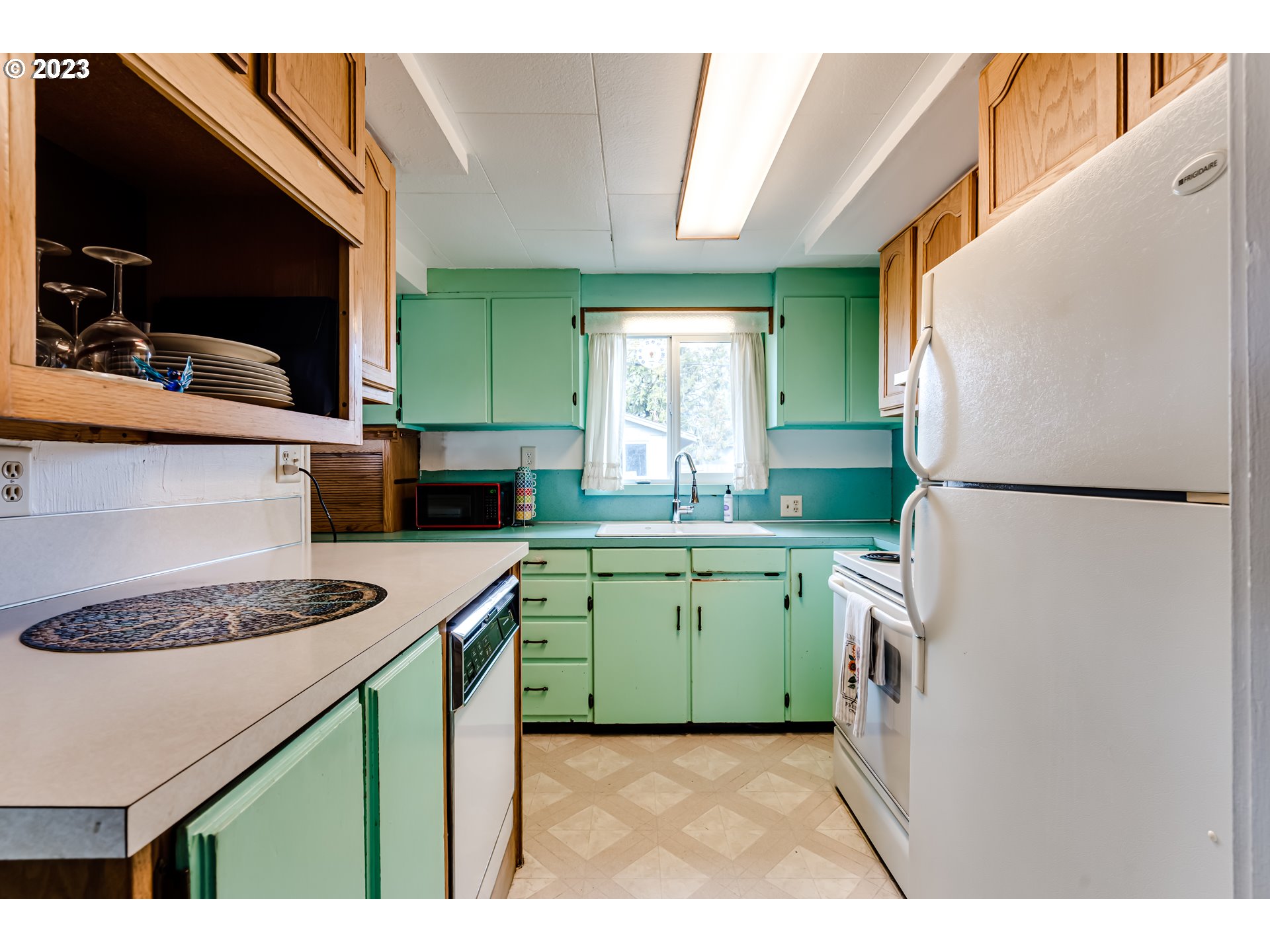 1858 I Street Springfield, OR 97477 - Photo 12 of 23 a kitchen with a refrigerator a sink and a stove