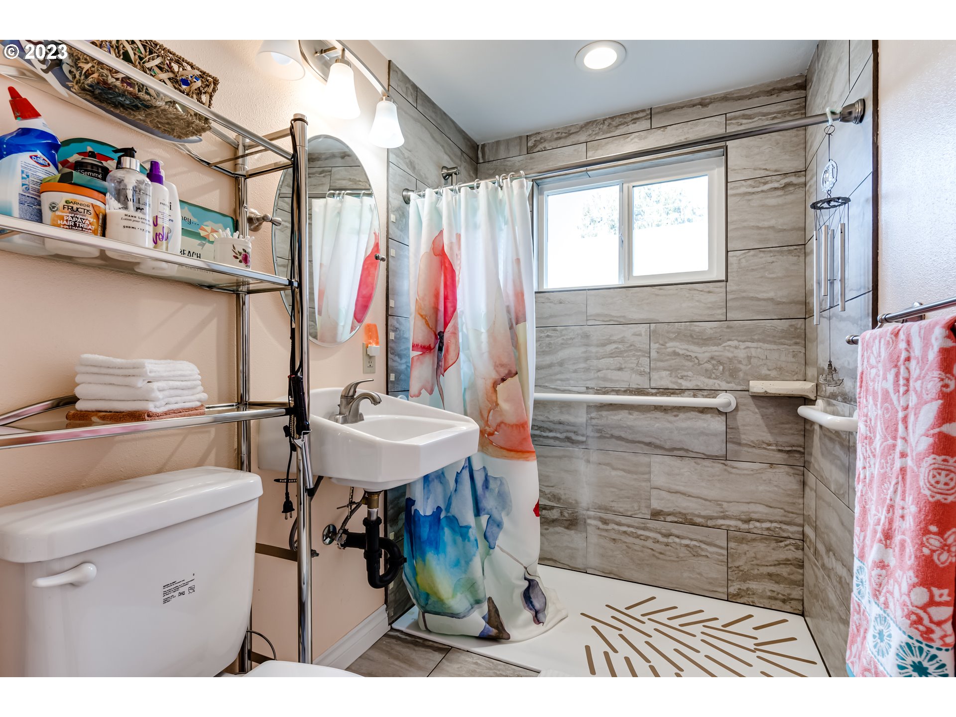 1858 I Street Springfield, OR 97477 - Photo 16 of 23 a bathroom with a sink a toilet and a shower curtain
