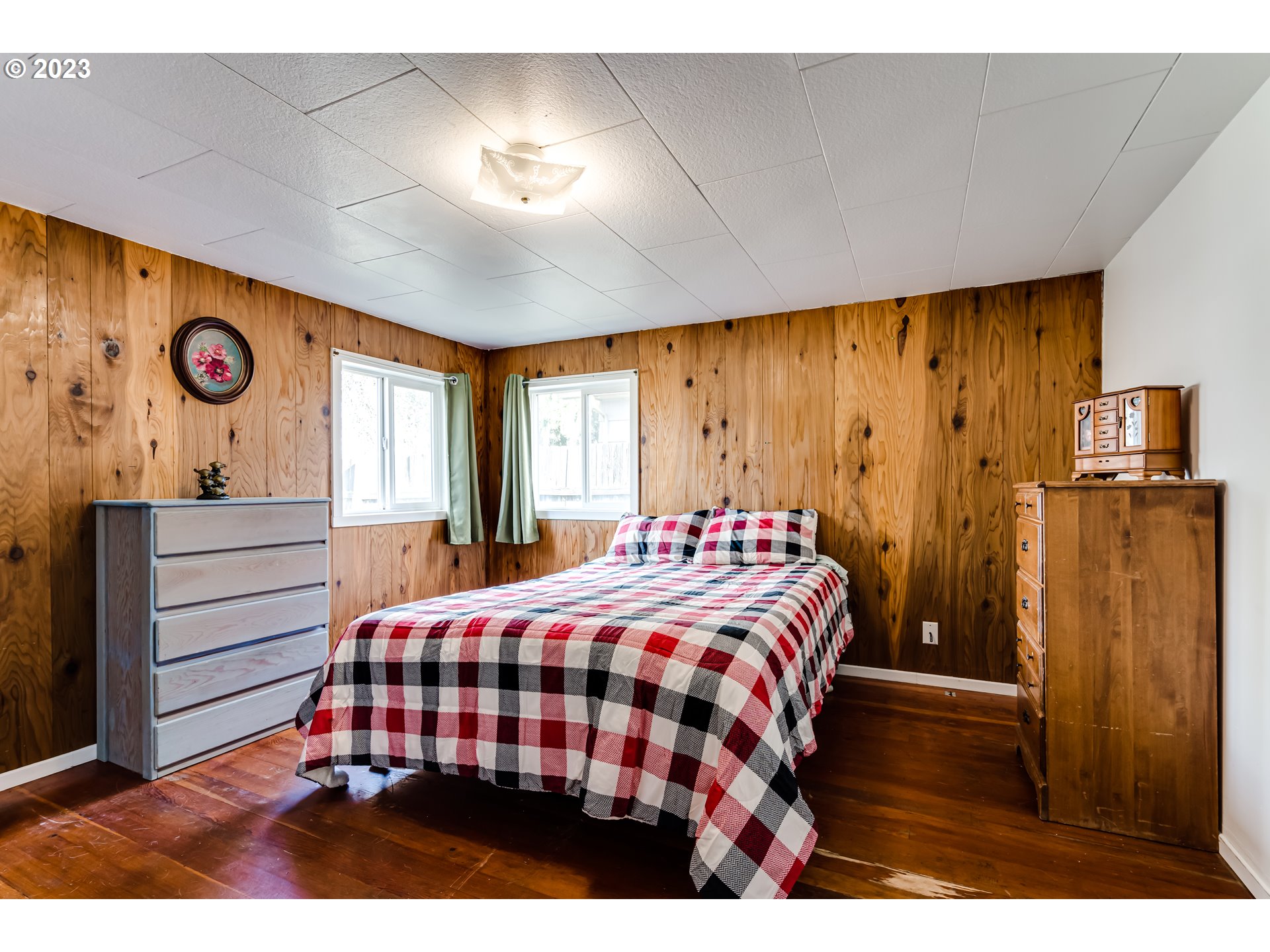 1858 I Street Springfield, OR 97477 - Photo 17 of 23 a bedroom with a bed and wooden floor
