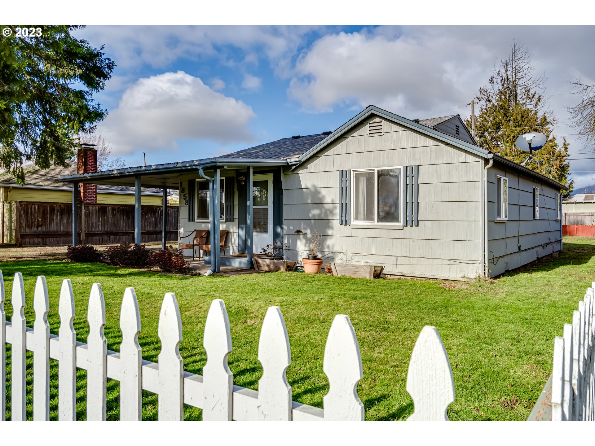 1858 I Street Springfield, OR 97477 - Photo 2 of 23 a front view of a house with a yard table and chairs