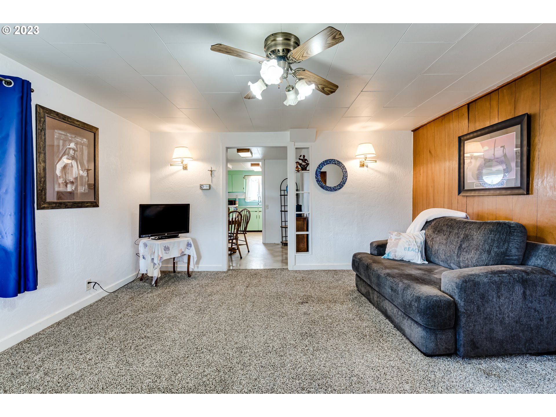 1858 I Street Springfield, OR 97477 - Photo 9 of 23 a living room with furniture and a flat screen tv