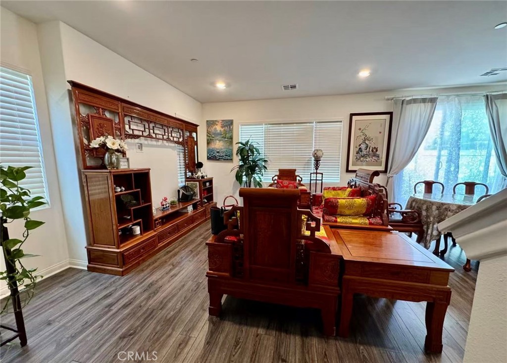 10664 Busch Street Spring Valley, CA 91978 - Photo 3 of 14 a living room with furniture a flat screen tv and a large window