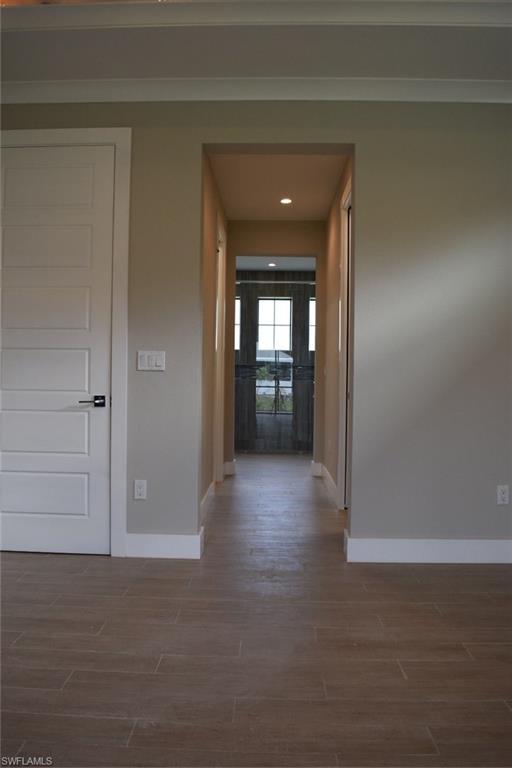 9045 Aster Road Fort Myers, FL 33967 - Photo 11 of 23 a view of a hallway to an empty room and fire place