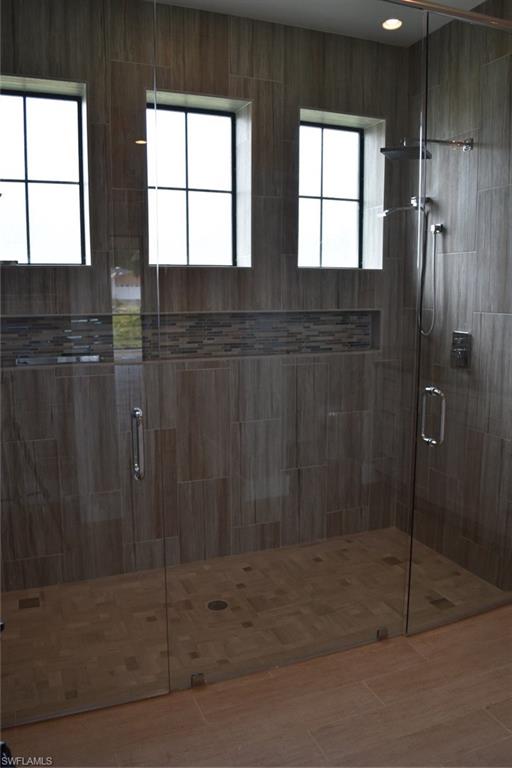 9045 Aster Road Fort Myers, FL 33967 - Photo 13 of 23 a bathroom with a shower
