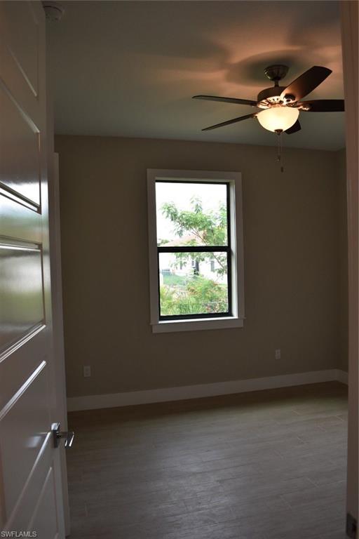 9045 Aster Road Fort Myers, FL 33967 - Photo 14 of 23 a view of an empty room with a window