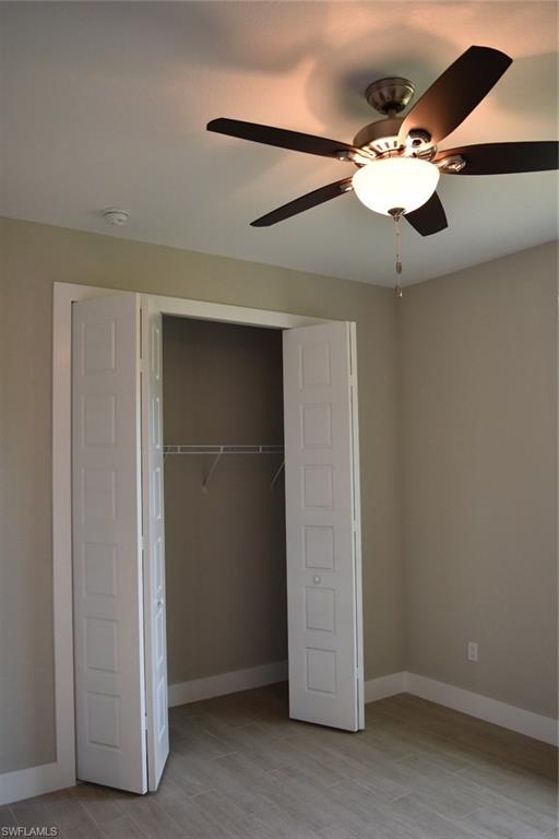 9045 Aster Road Fort Myers, FL 33967 - Photo 15 of 23 an empty room with fan