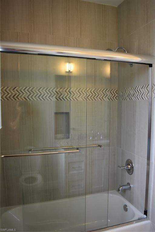 9045 Aster Road Fort Myers, FL 33967 - Photo 18 of 23 a bathroom with a shower
