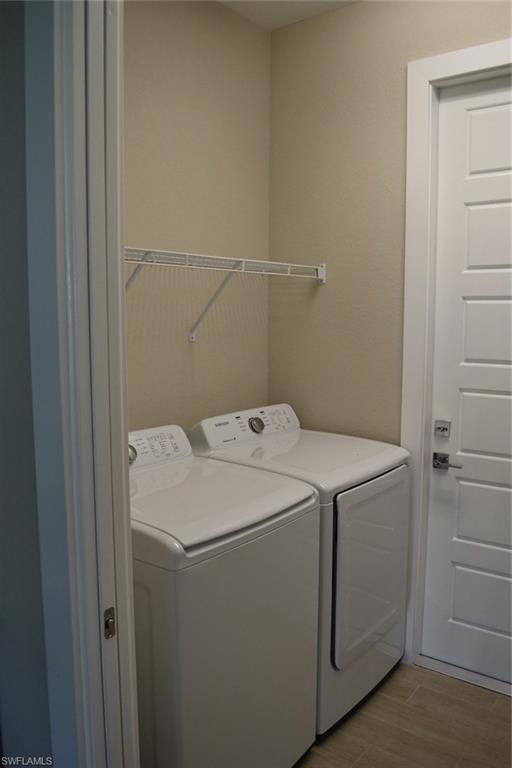 9045 Aster Road Fort Myers, FL 33967 - Photo 19 of 23 a utility room with dryer and washer