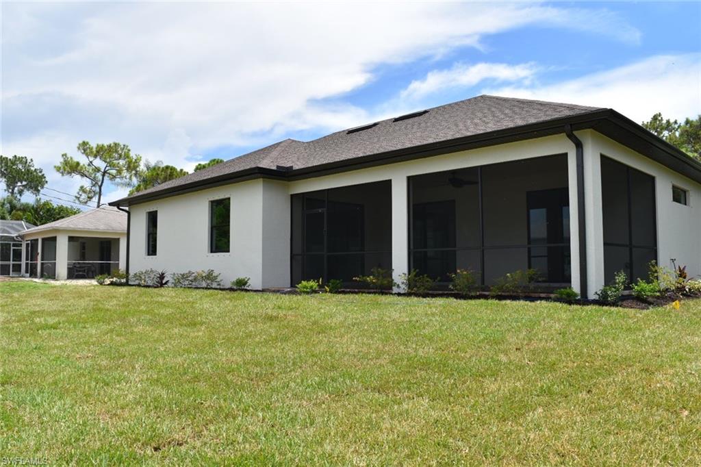 9045 Aster Road Fort Myers, FL 33967 - Photo 23 of 23 front view of a house with a yard