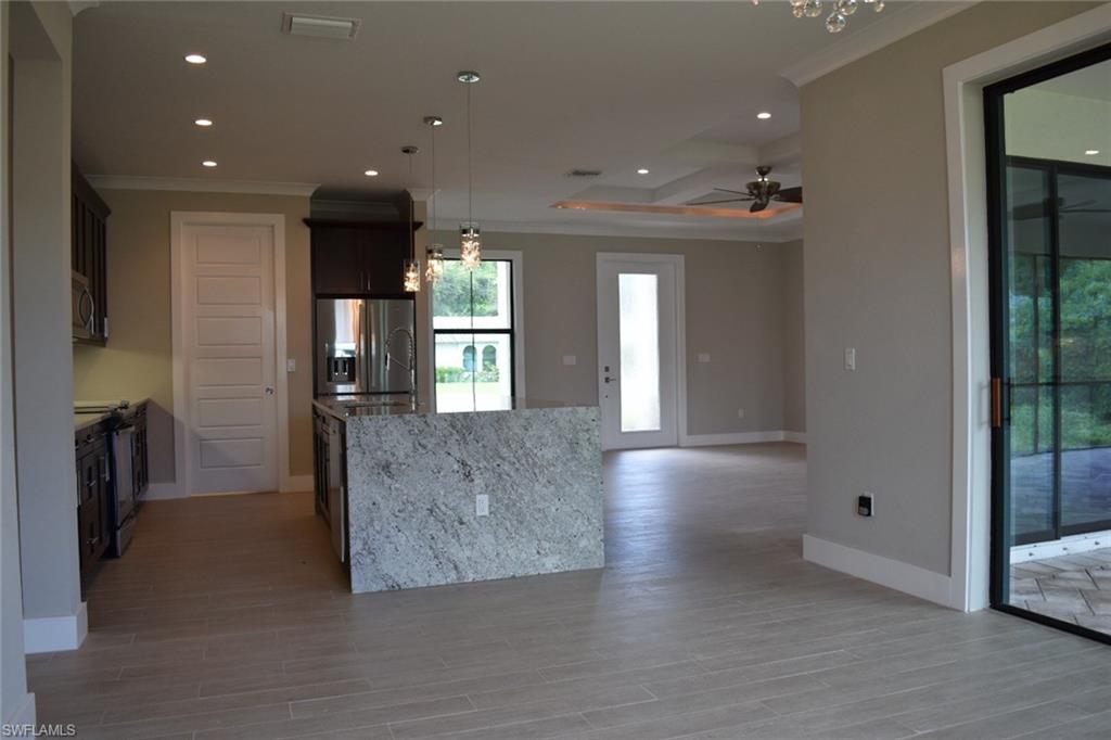 9045 Aster Road Fort Myers, FL 33967 - Photo 8 of 23 a view of livingroom and kitchen with furniture