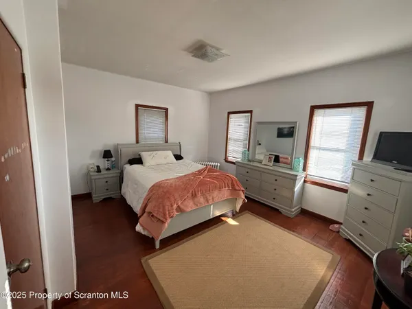 a bedroom with a bed and furniture