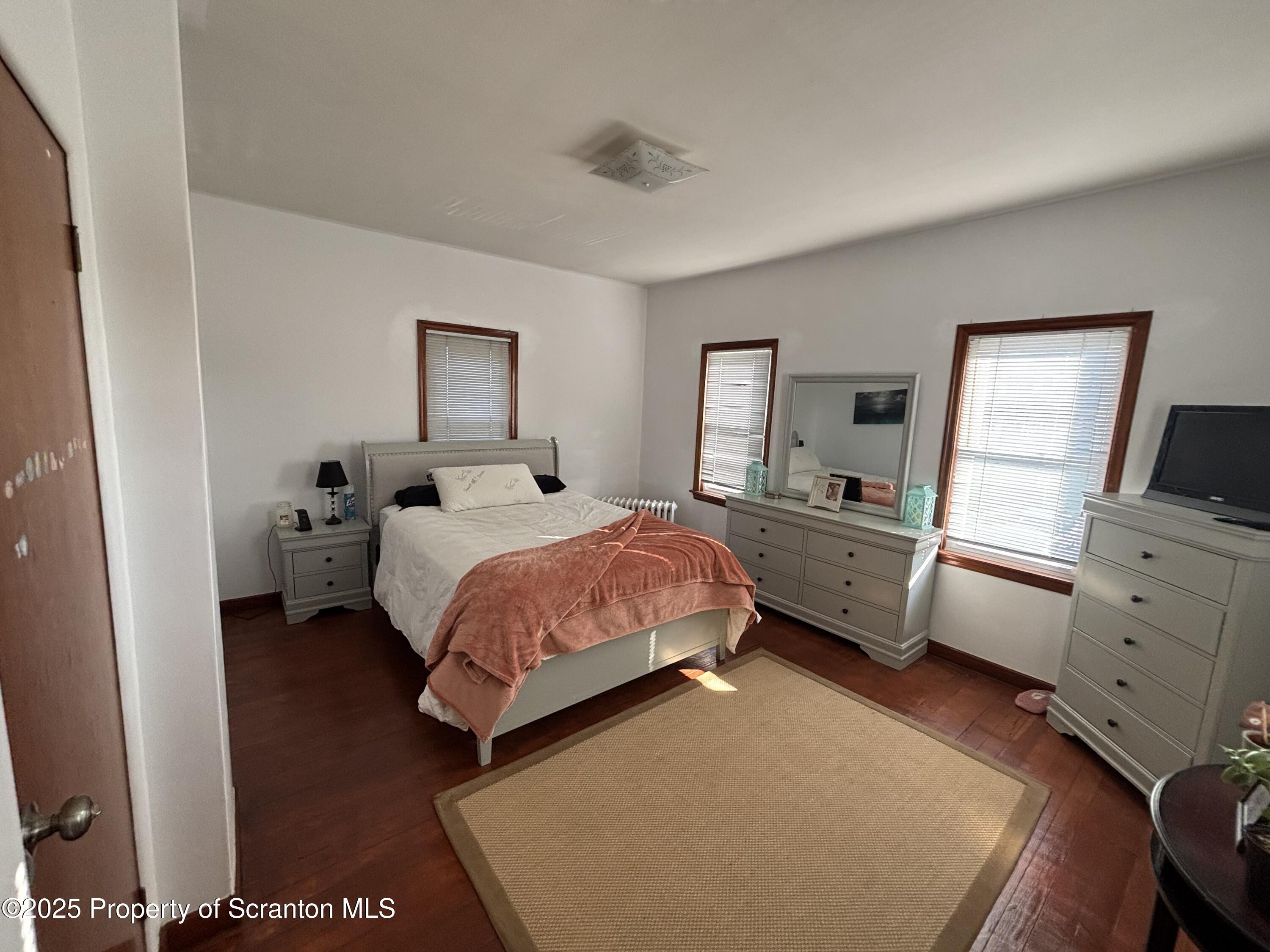 719 Saginaw Street Scranton, PA 18505 - Photo 16 of 23 a bedroom with a bed and furniture