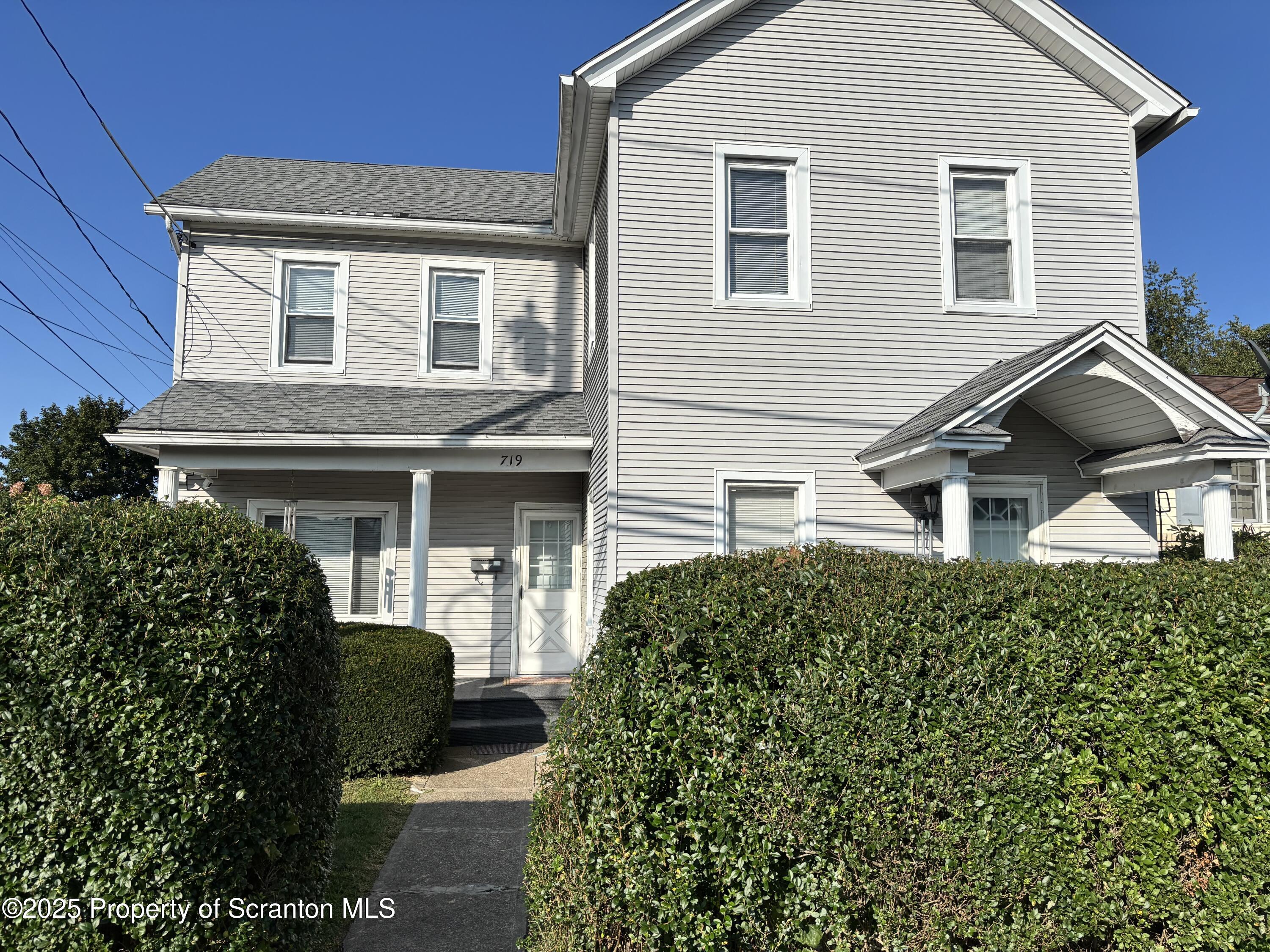 719 Saginaw Street Scranton, PA 18505 - Photo 2 of 23 a front view of a house with a yard