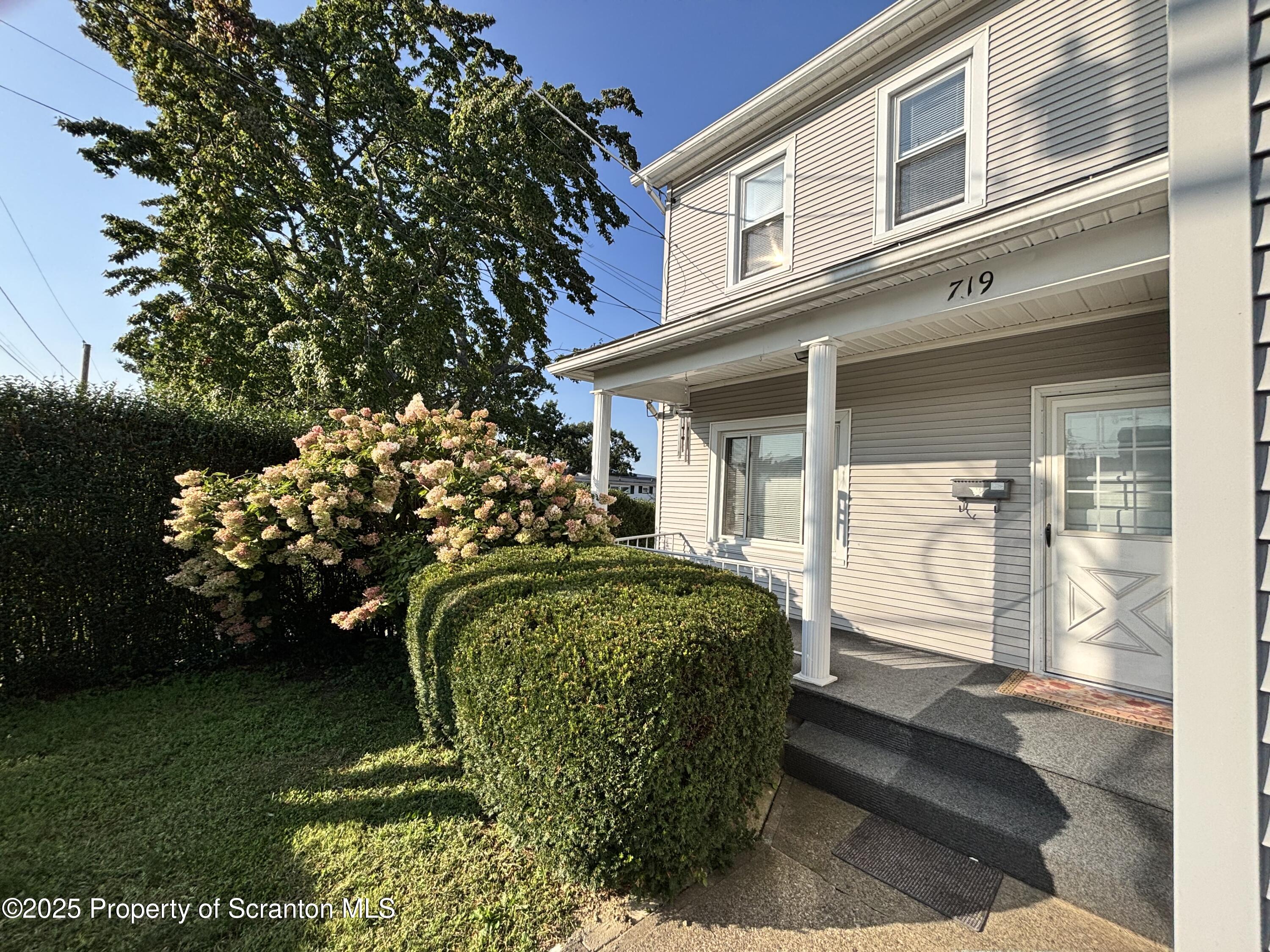 719 Saginaw Street Scranton, PA 18505 - Photo 3 of 23 a view of a porch with a bench