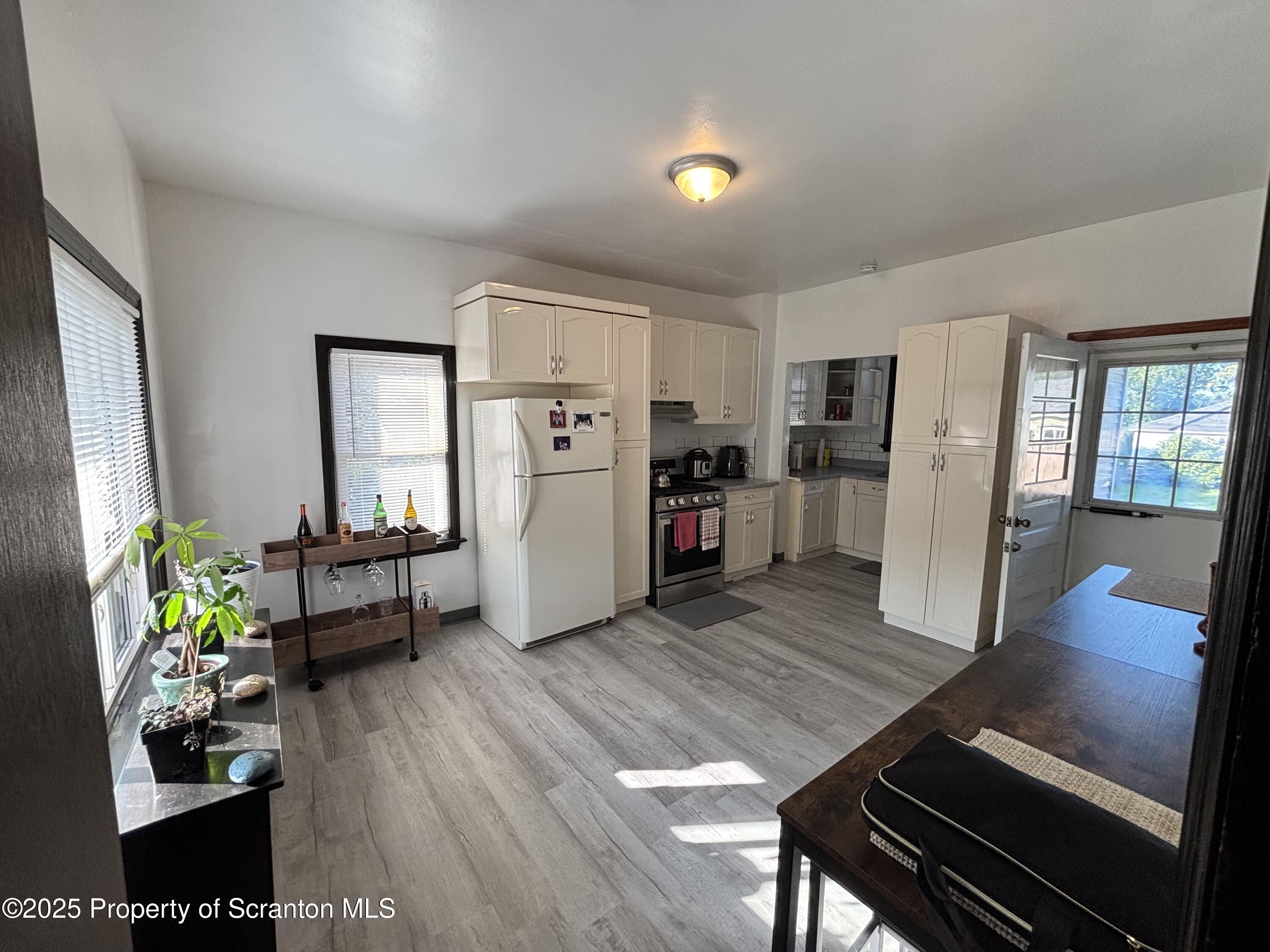 719 Saginaw Street Scranton, PA 18505 - Photo 7 of 23 a living room with furniture and a table